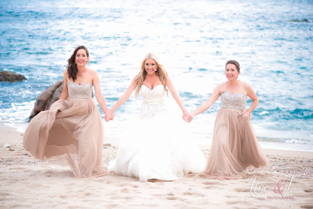 bride and bridesmaids on beach 