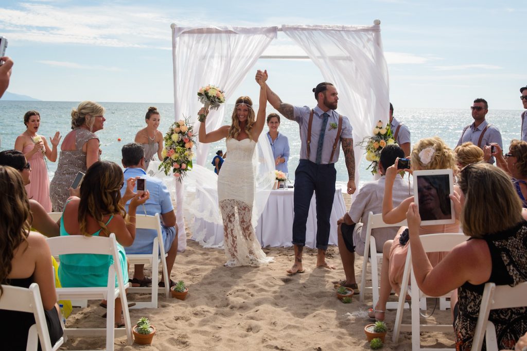 Beach gazebo set up with wedding couple 