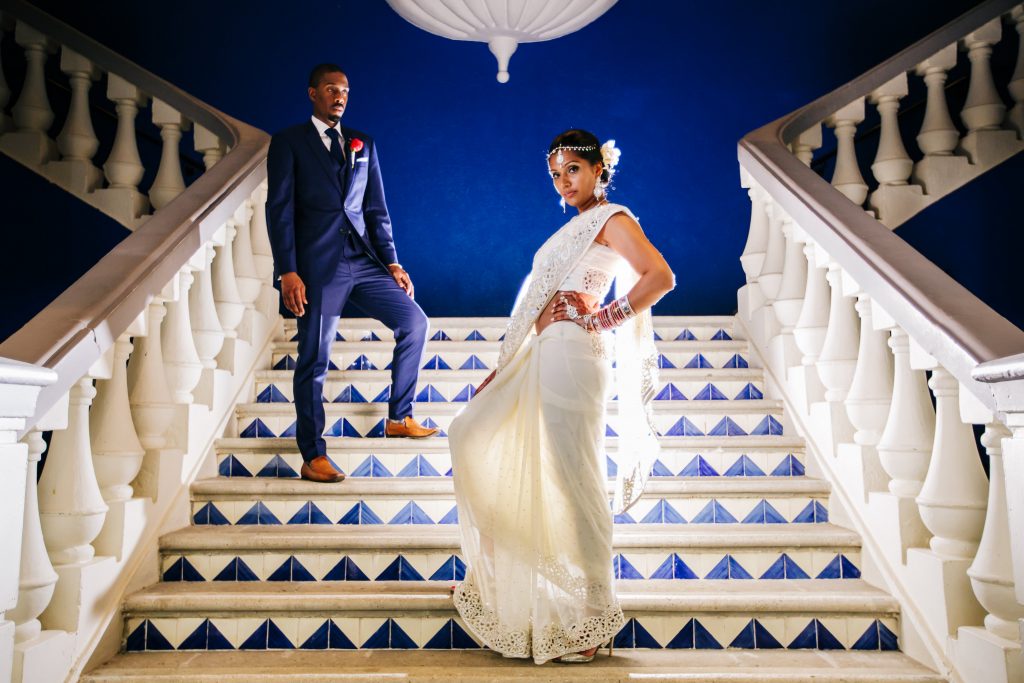 Liz Moore Weddings loves this Hard Rock staircase with Indian Wedding Couple