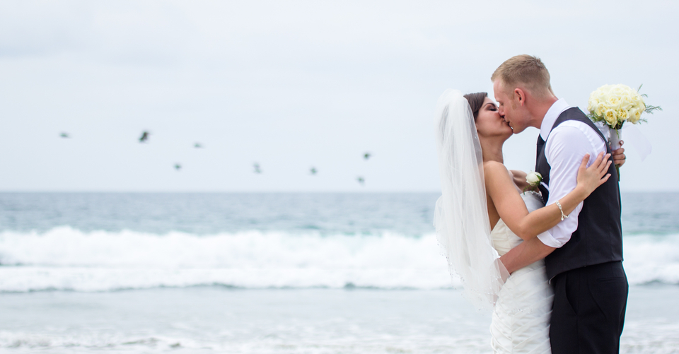 wedding couple on beach with seagulls
