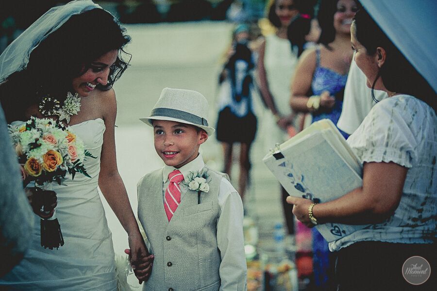  ring bearer with hat and tie in ceremony 
