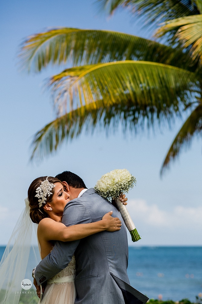  couple embracing under a palm tree
