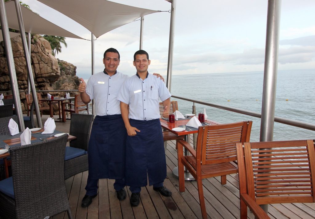 hyatt staff at restaurant by the ocean 