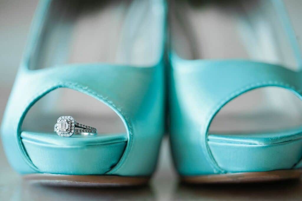  brides shoes with ring in them. 