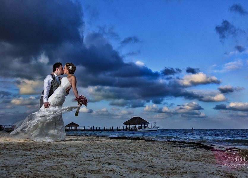  couple on the beach in the evening for wedding shoot.