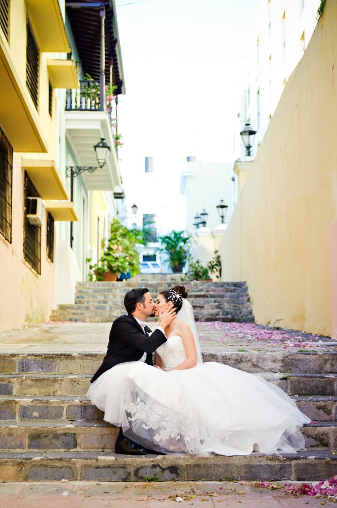 3 Wedding_Maria_Julian- sharing a kiss in the streets of San Juan. 