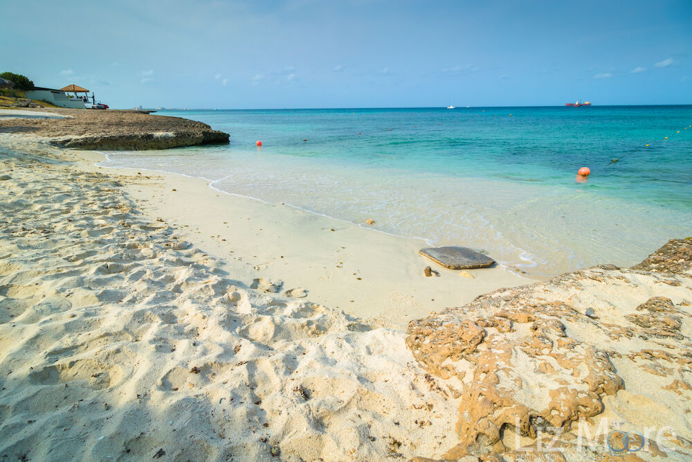 Aruba beaches have stunning white sand with the bluest of Caribbean water