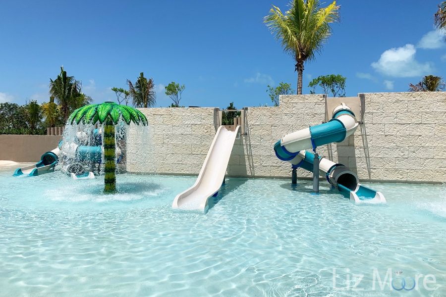 childrens play area Including small waterslides and palm tree With watering waterfall