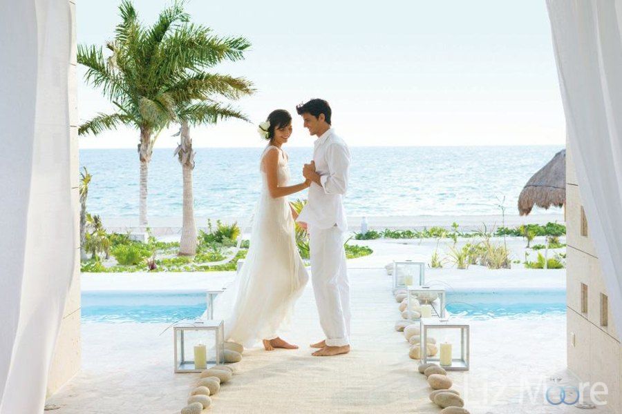 Wedding couple in bracing on the stone path way Over the main pool