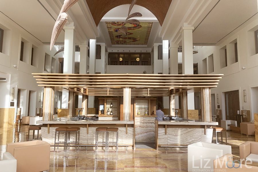 Do you have indoor lobby bar with surrounded marble floors and high vaulted ceiling's
