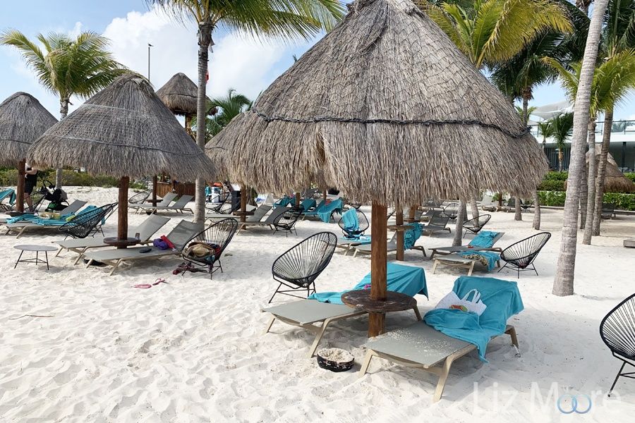 beach cabanas With thatched roof umbrellas