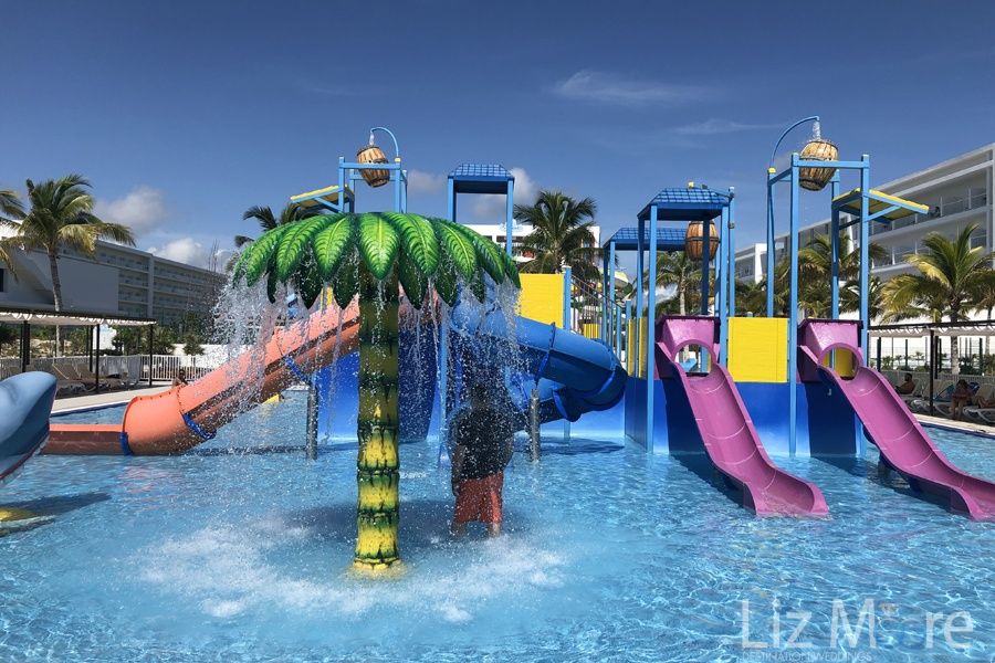 children's play area with waterslides and water features
