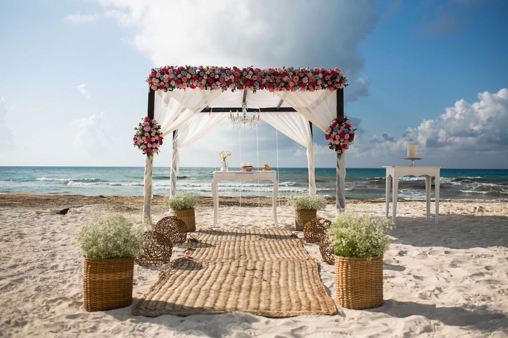 Beautiful destination wedding ceremony decor on the beach