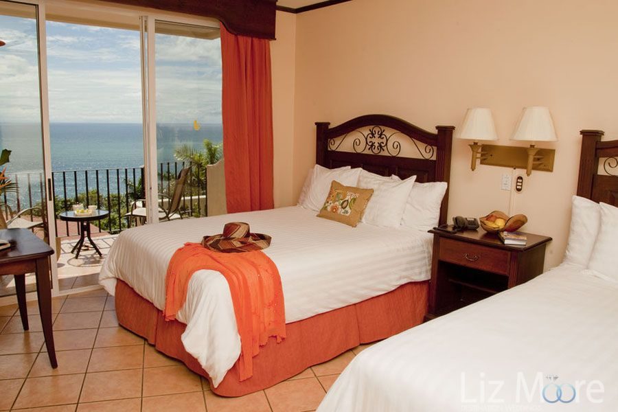 Hotel-Parador-Resort-Spa-bedroom-with-balcony-qbmyjwrvpye2ja602u5i6auc9sk4thm4tzd13ktrhs