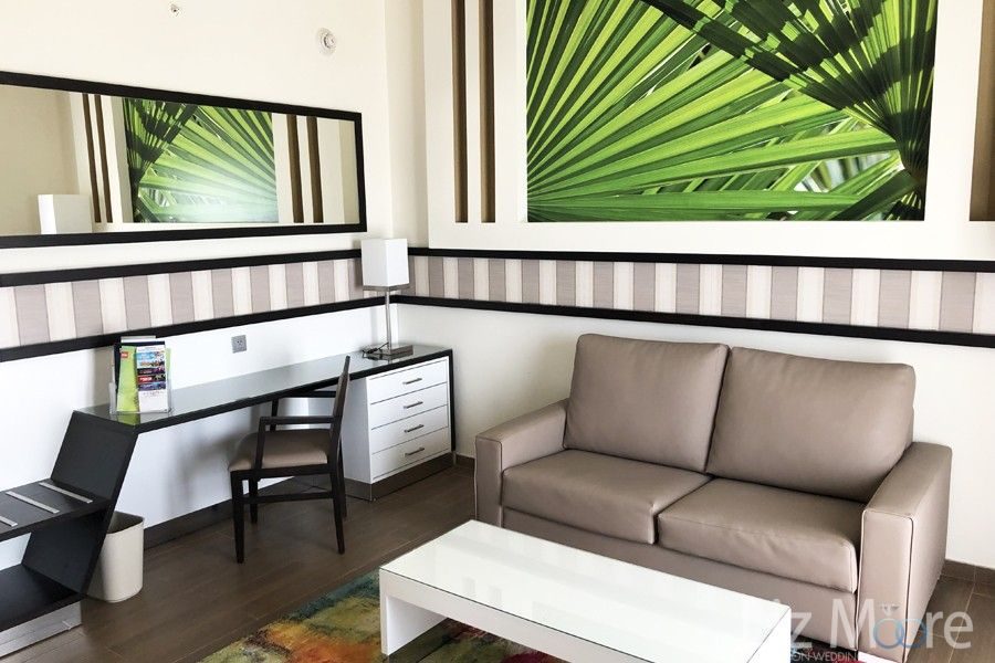 Hotel-Riu-Dunamar-Costa-Mujeres-bedroom-suite-lounge-area.jpg