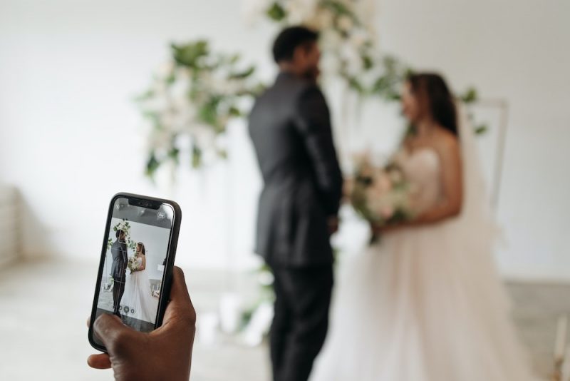 Taking a wedding couples picture with a phone